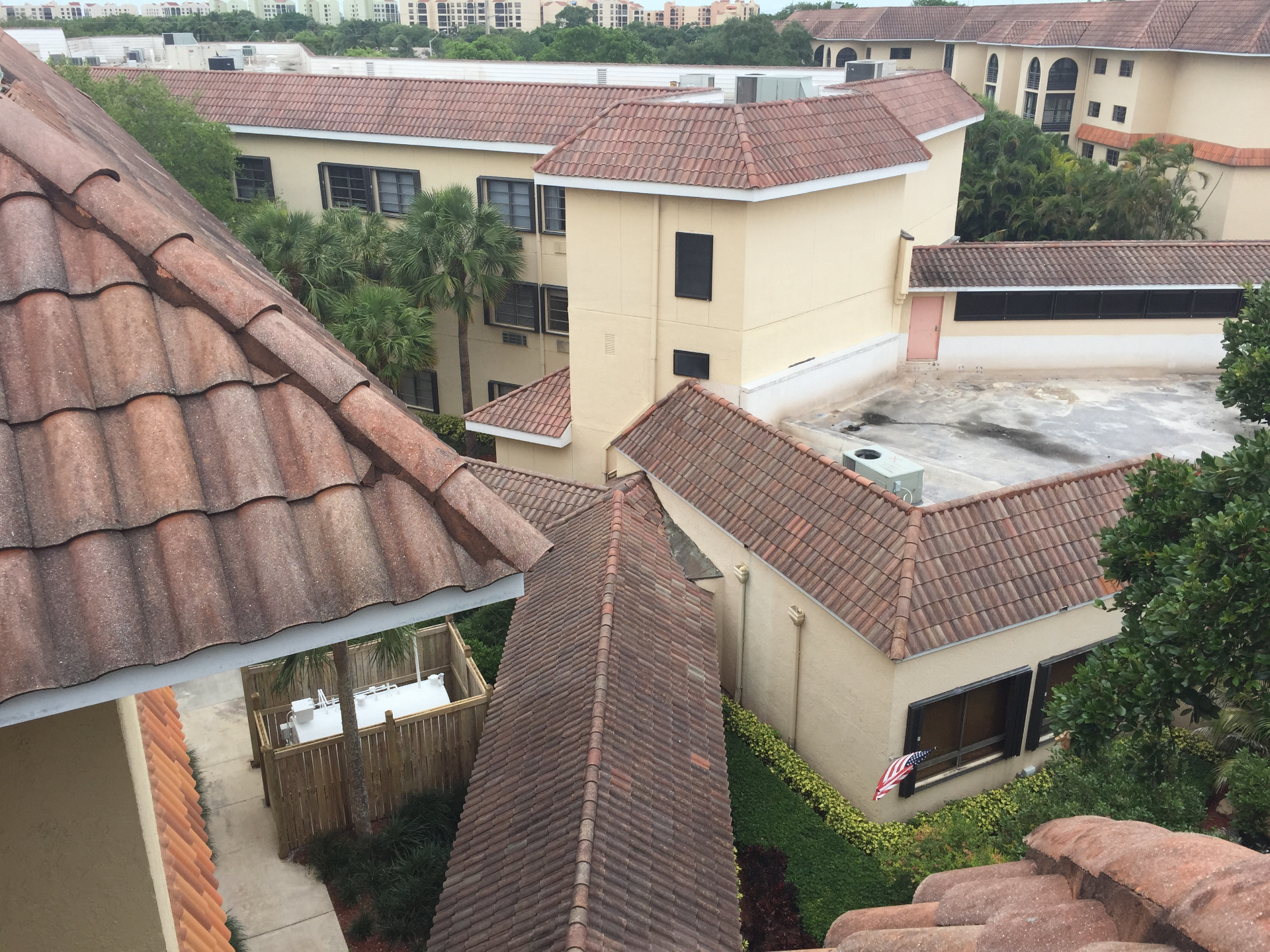 Aerial view across the Axe Retirement complex showing multiple tile-roof buildings, courtyards, and the scale of the roof cleaning contract
