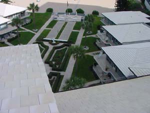A closer look at the pitched runs of standing-seam roofing surrounding the courtyard.