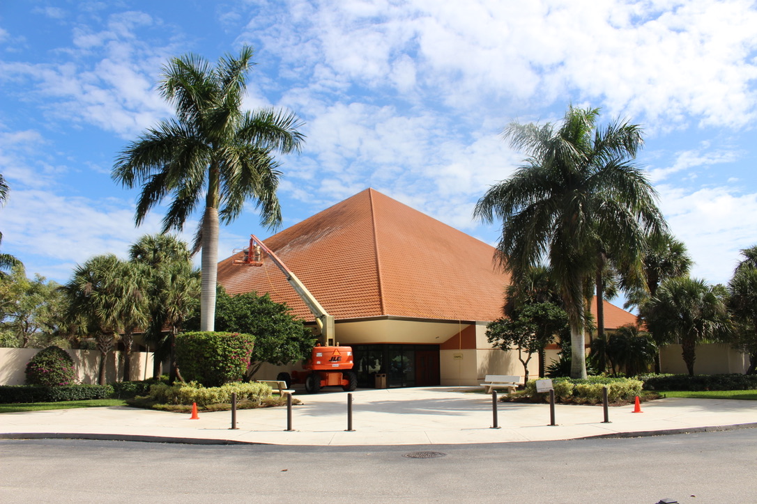 Commercial tile roof cleaning for a Catholic church with a boom lift