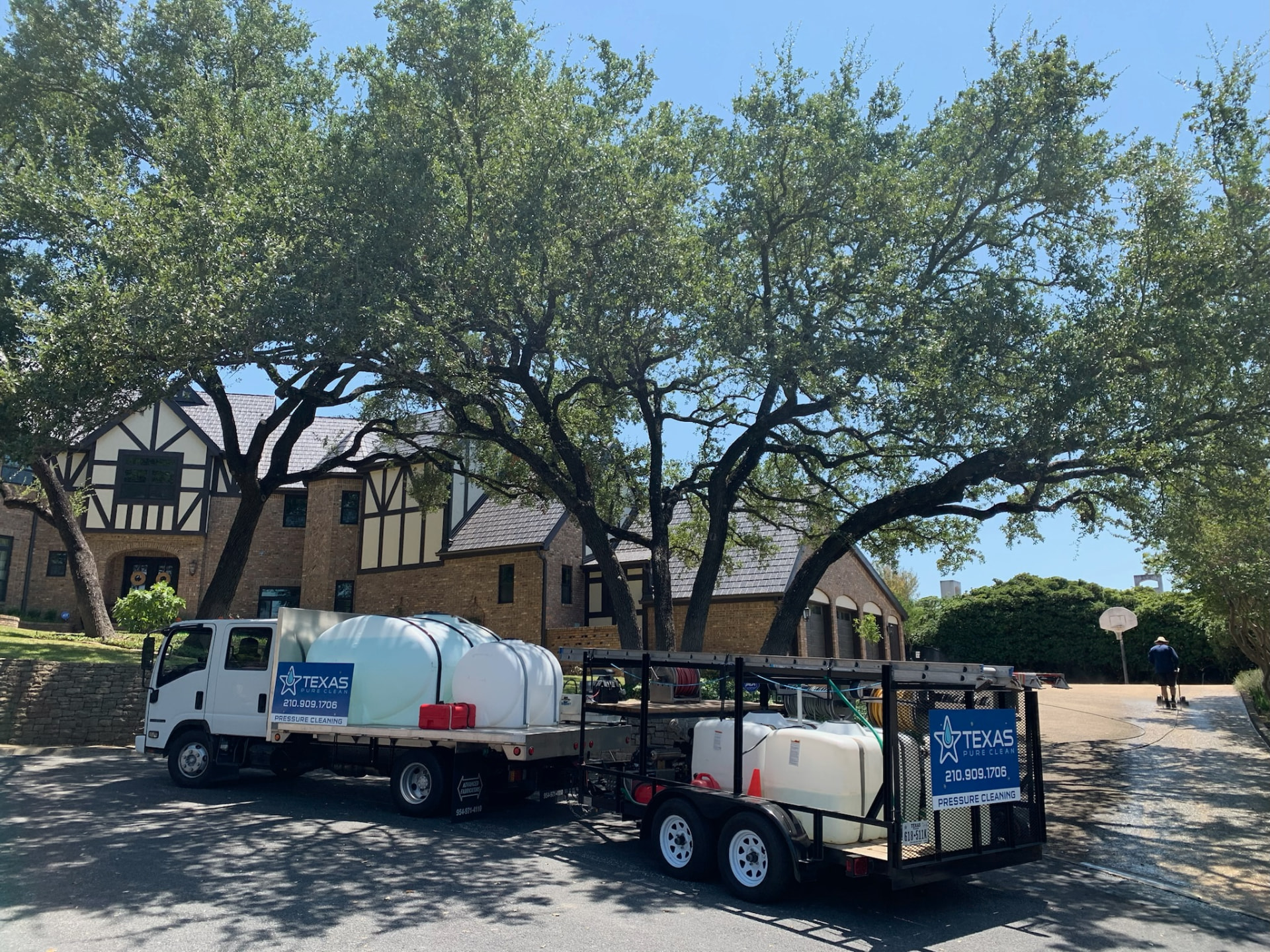Texas Pure Clean truck and trailer rig parked at a Helotes home