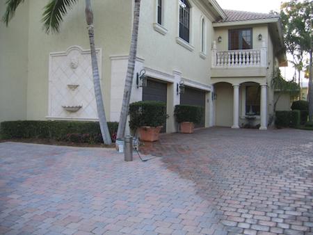 Brick paver driveway with half sealed and half unsealed for comparison