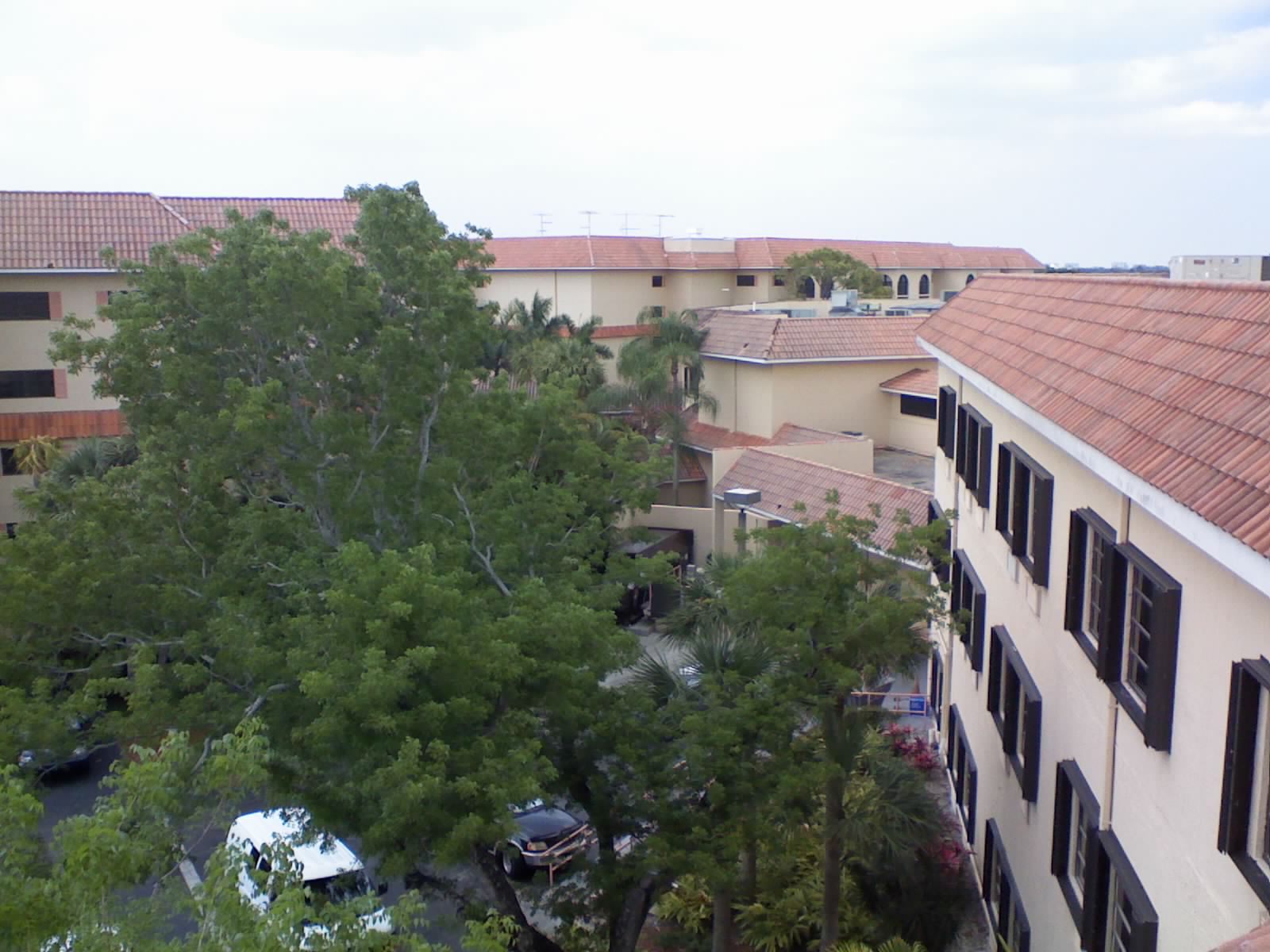 Overview of the Axe Retirement complex from a rooftop vantage point, showing the scale and layout of the tile-roofed buildings we serviced