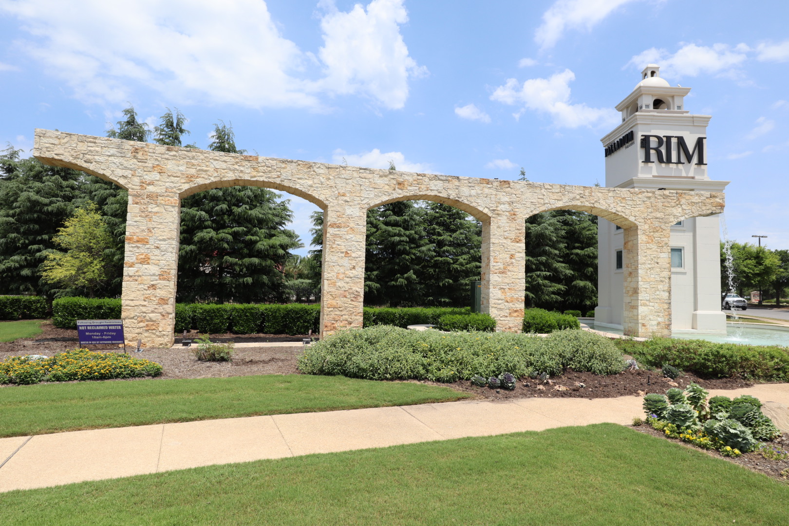 The Rim Shopping Center limestone archway after soft-wash cleaning
