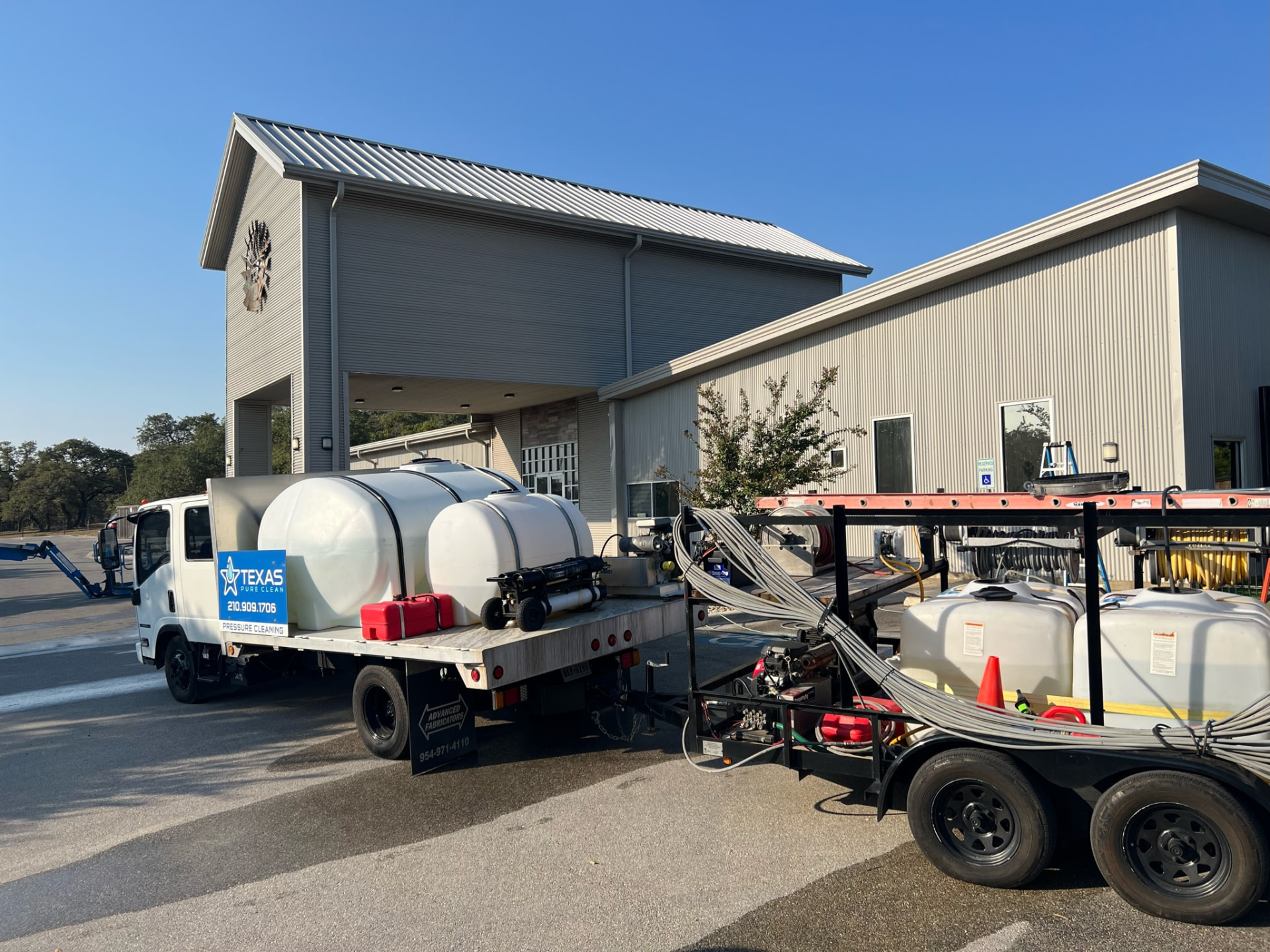 Texas Pure Clean pressure washing truck and rig at an Alamo Heights commercial property