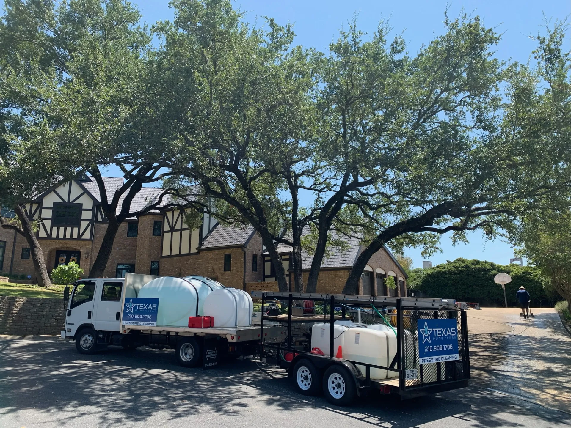 Texas Pure Clean truck and trailer rig parked at a Helotes home