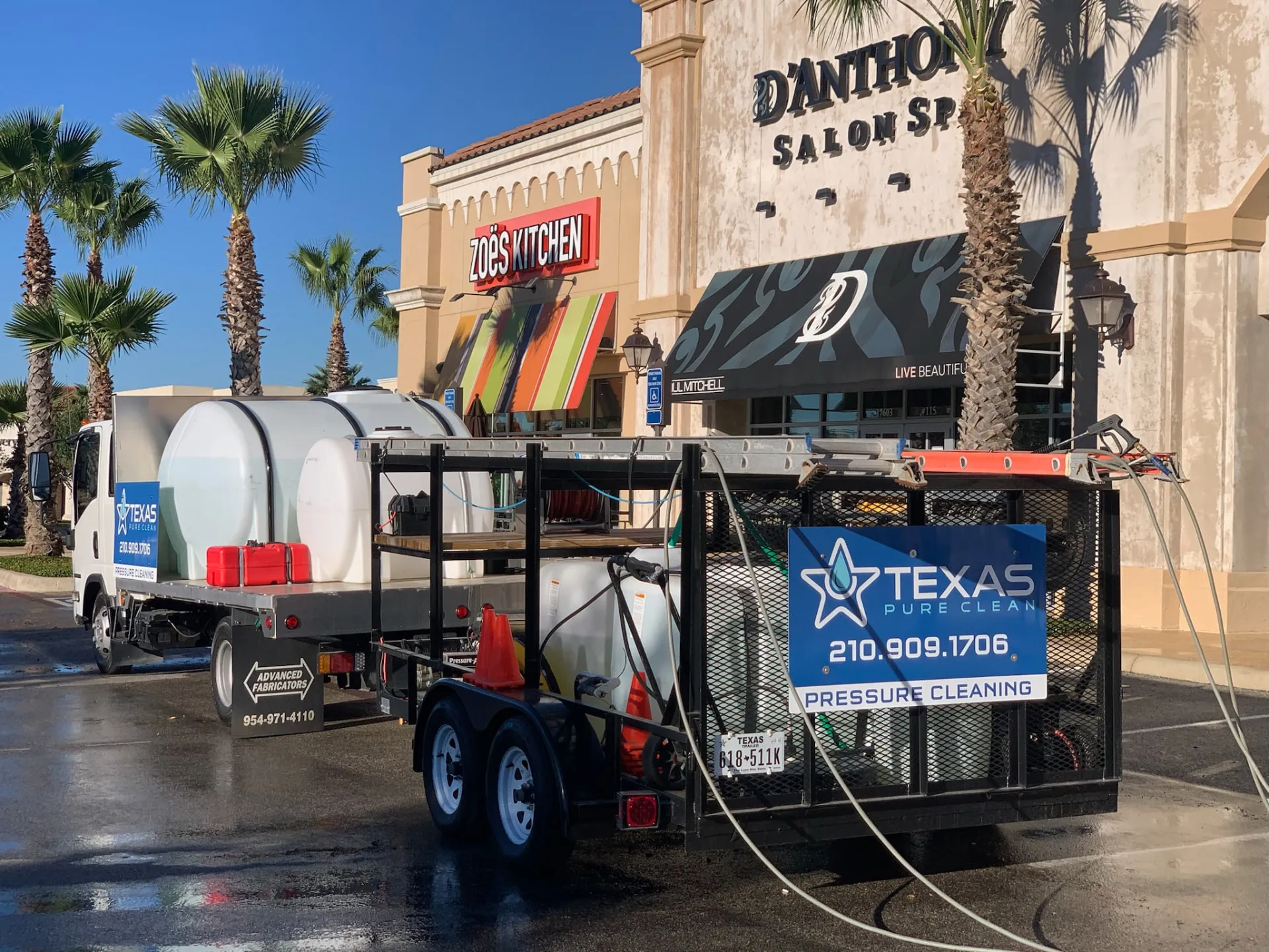 Texas Pure Clean pressure washing truck and rig at a San Antonio shopping center