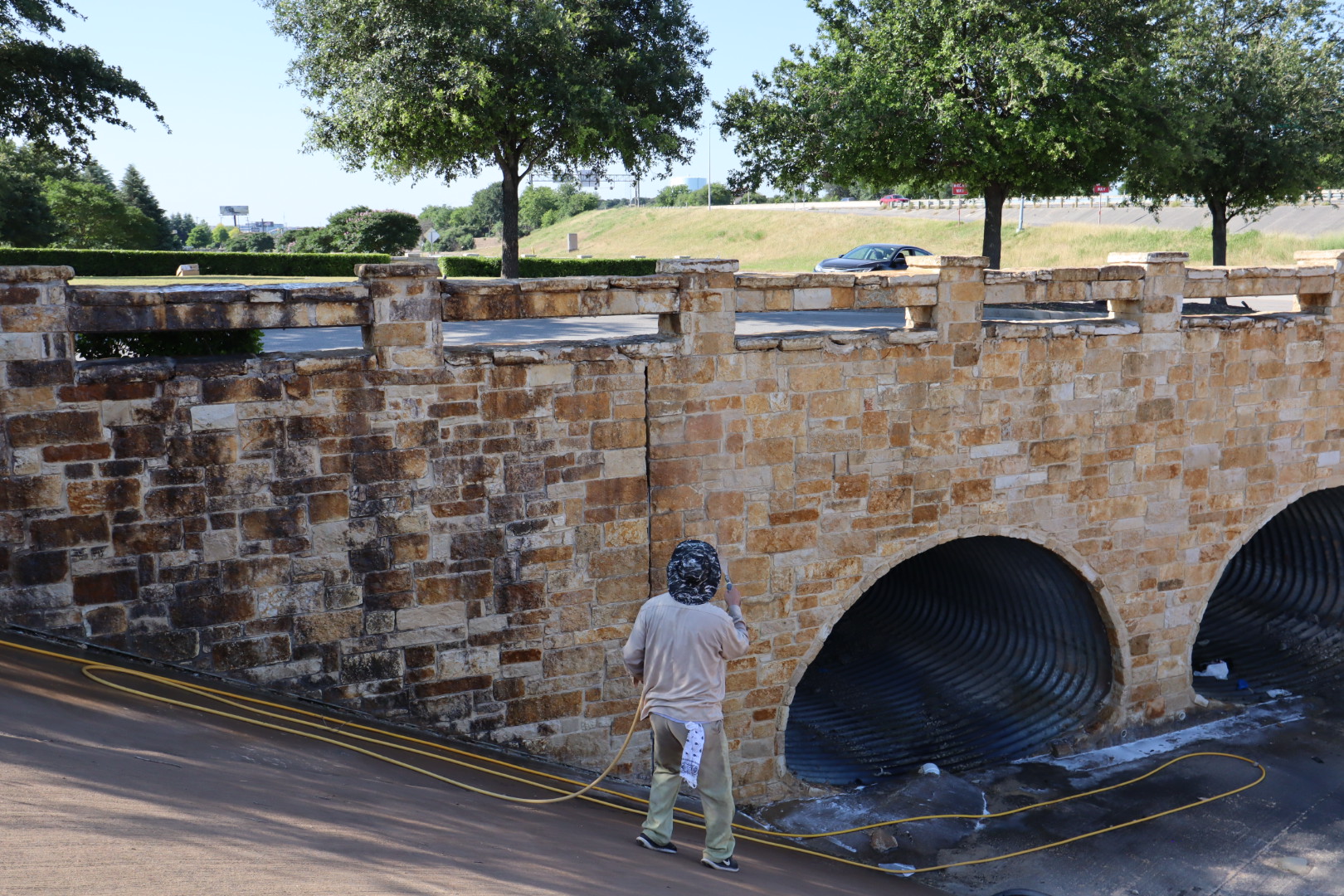 A wide view of one of the bridges during our work. Notice the scale — these are large commercial installations, and every square foot was treated by hand.